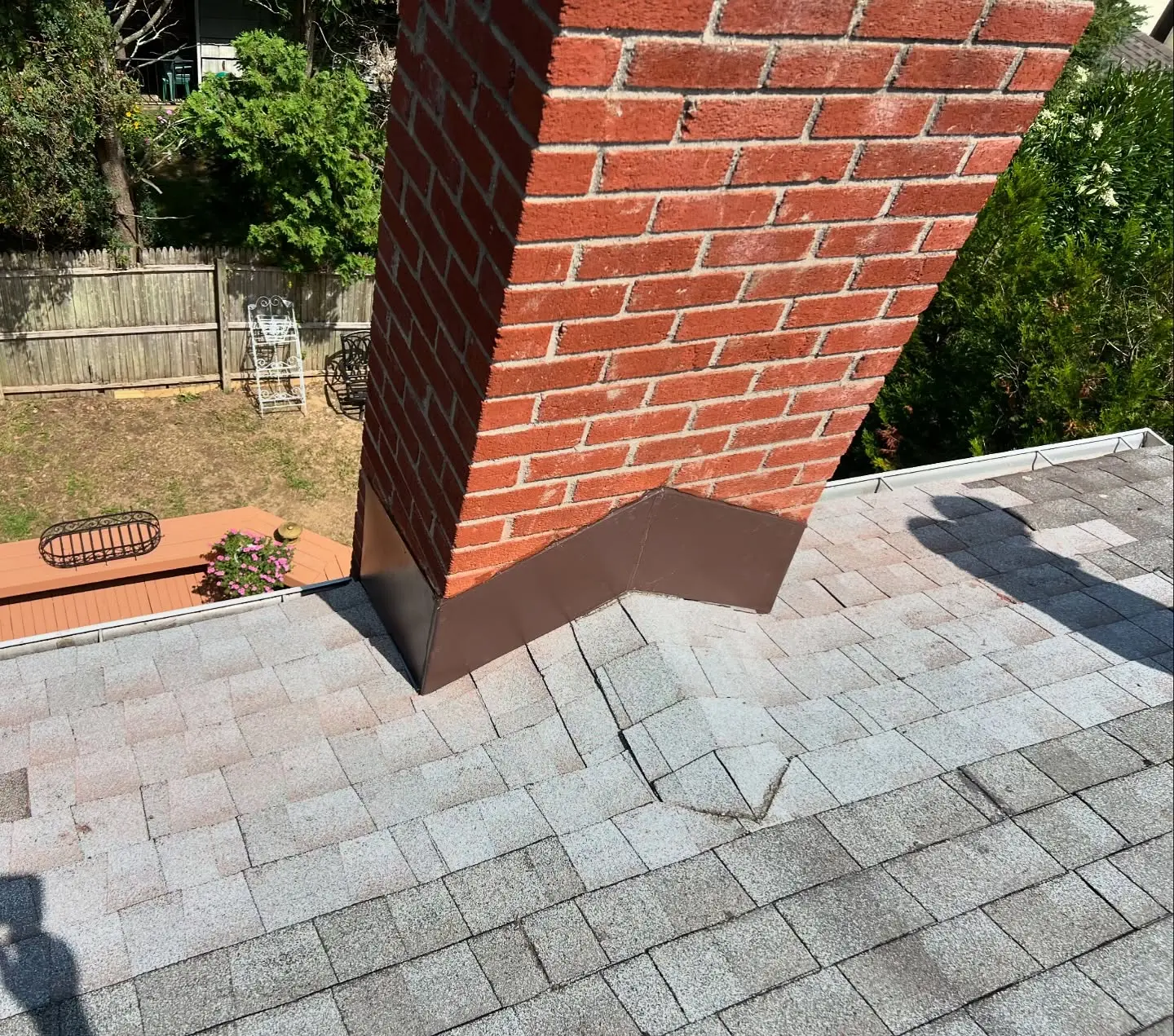 Brick chimney flashing and roof repair