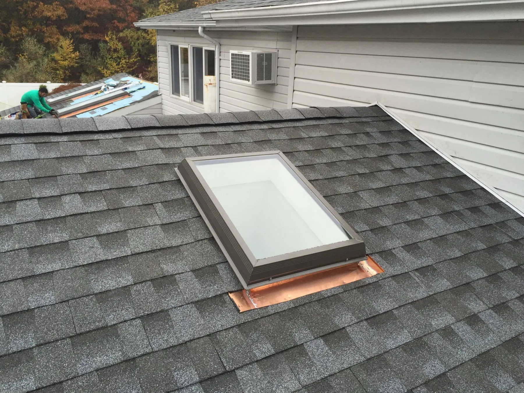 Skylight installation on a shingle roof